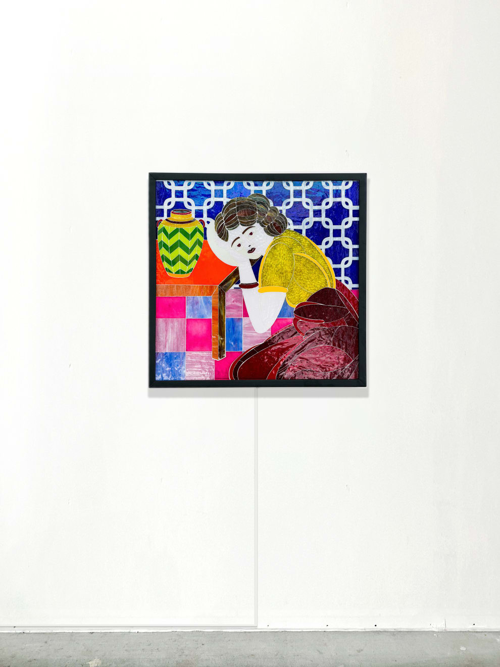 stained glass mosaic of a girl leaning on a table