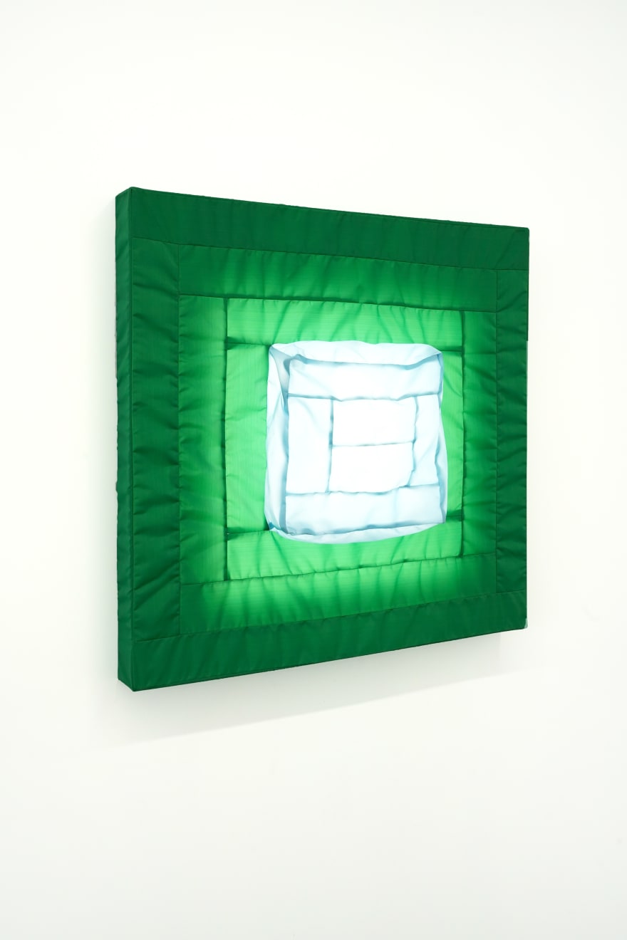 green fabric light hung on wall