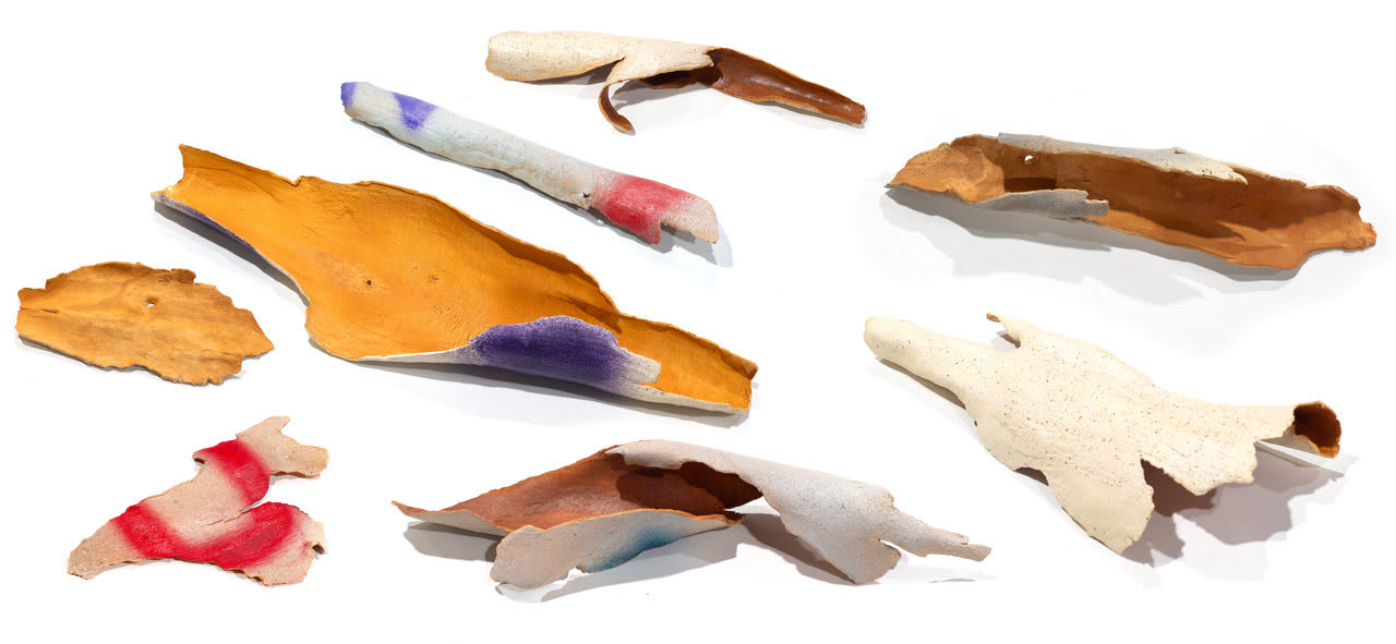 photo of a ceramic artwork made to look like pieces of bark from a eucalyptus tree