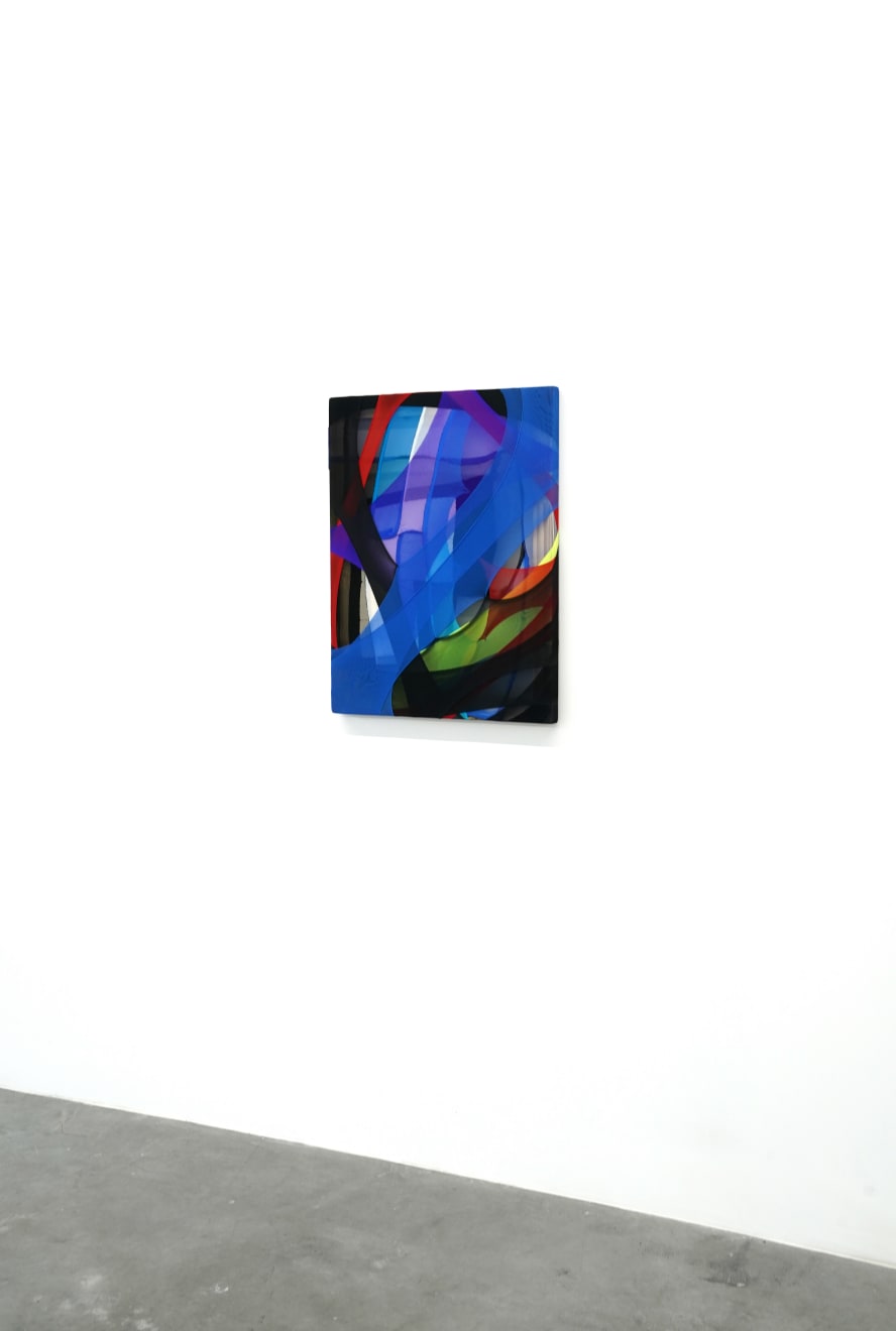 abstract fabric piece with blue, purple, green red and black