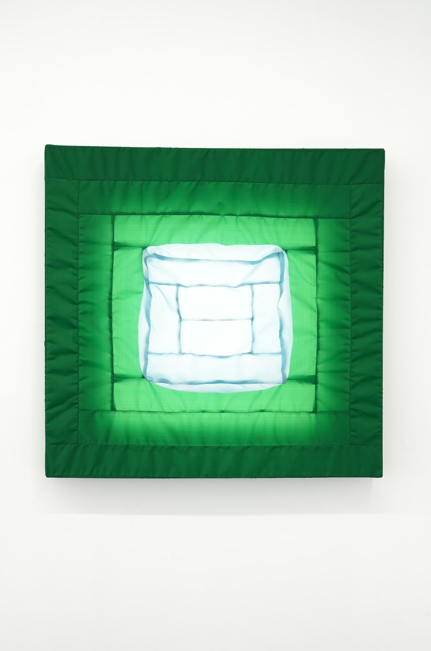 green fabric light hung on wall