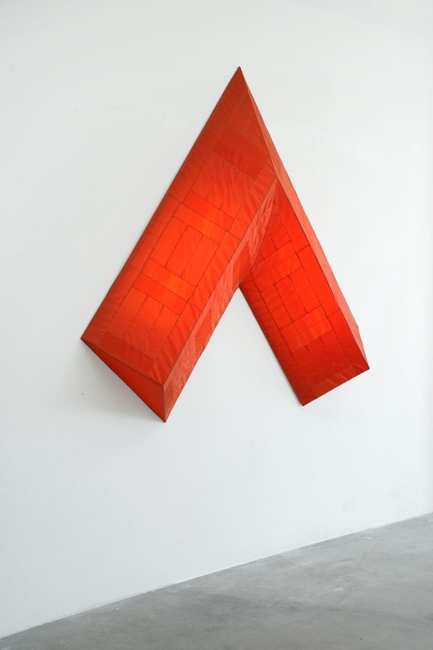 red arrow wall lamp mounted on a white wall