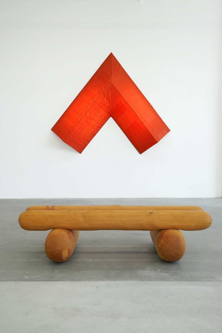 red arrow wall lamp mounted on a white wall