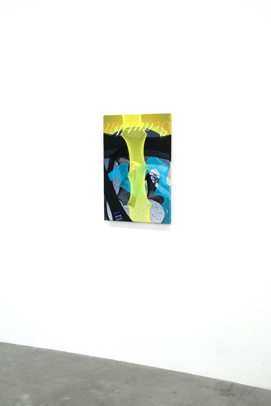 abstract fabric artwork including a text that says 