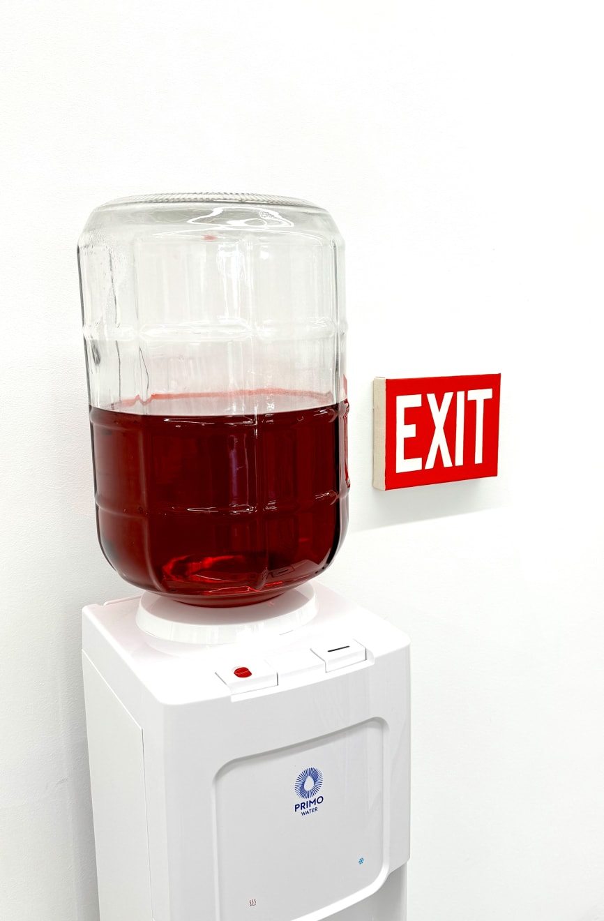 water cooler with an exit sign
