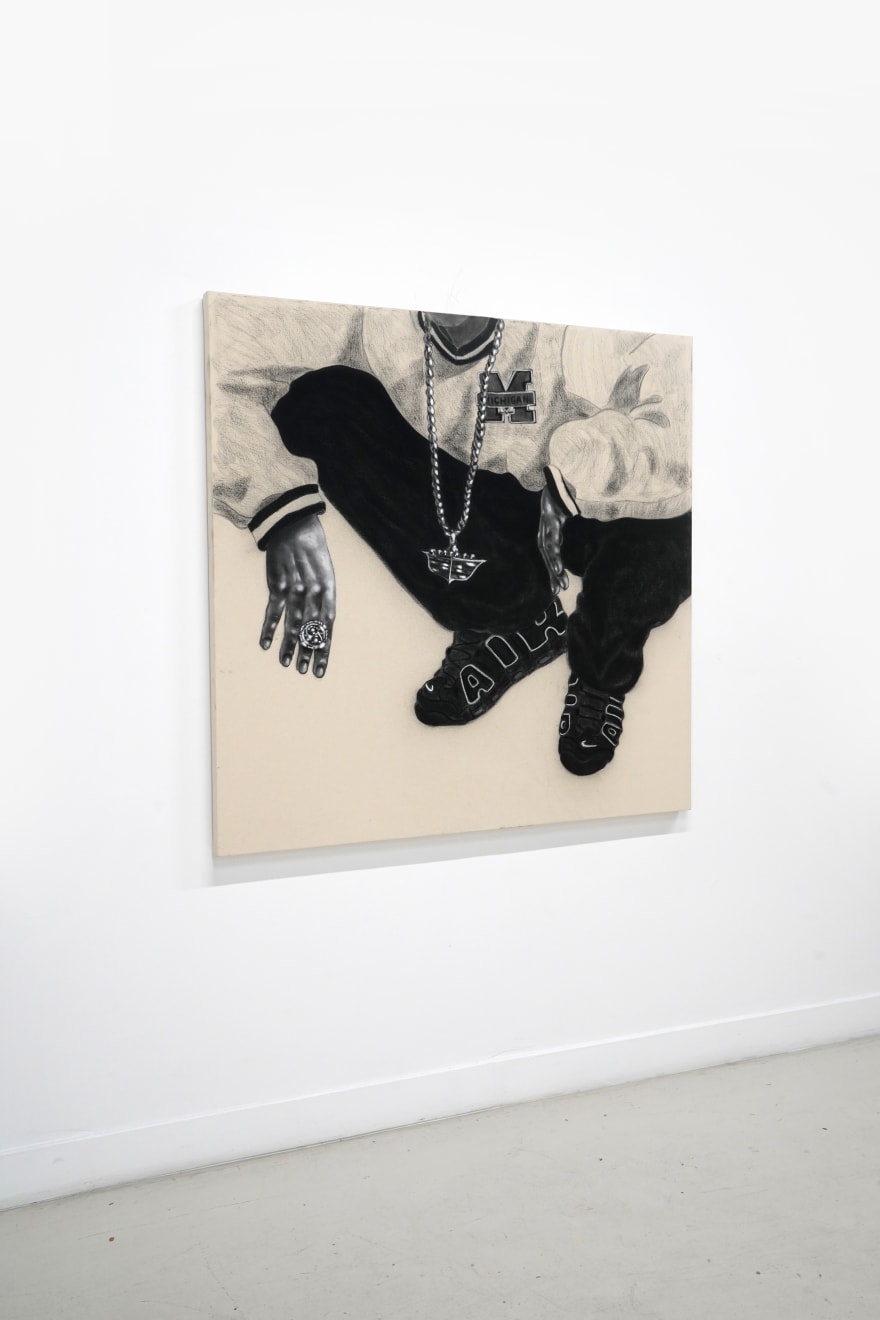 charcoal drawing of a man crouching wearing air jordans and a cadillac symbol necklace