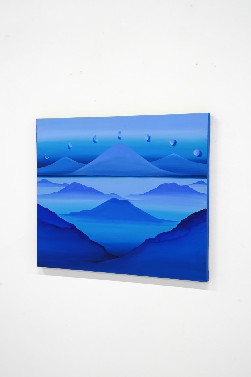 blue paintings on mountain landcape with moons above it