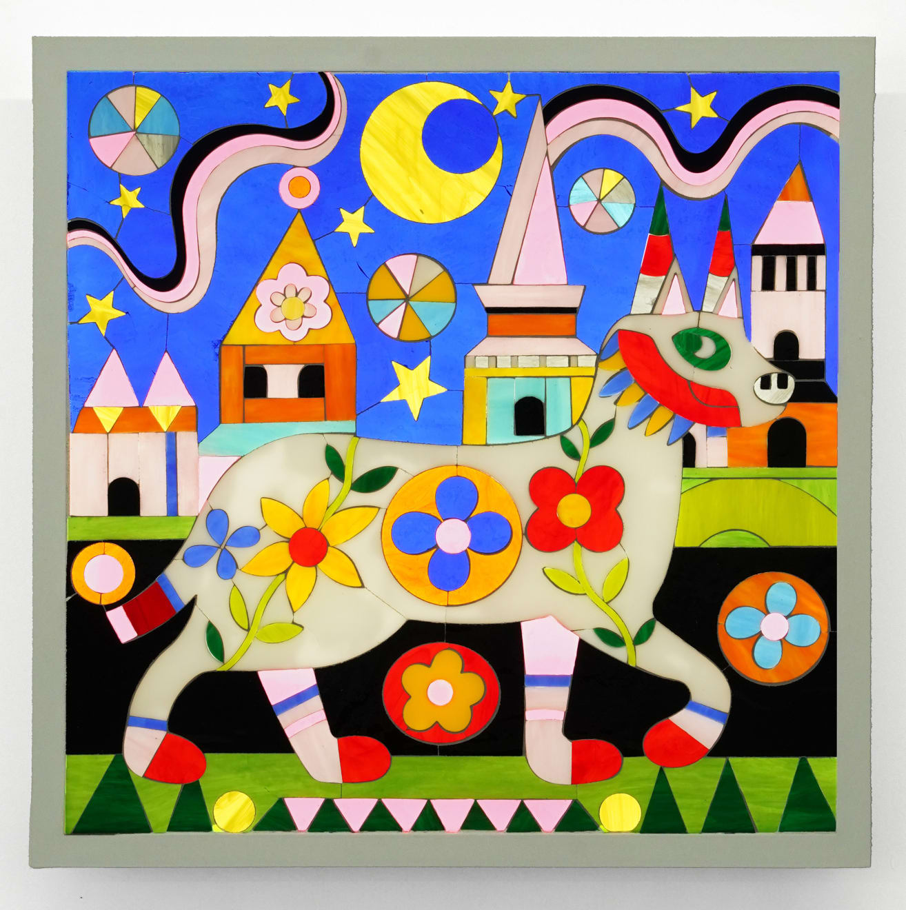 stained glass artwork with a dog and a castle