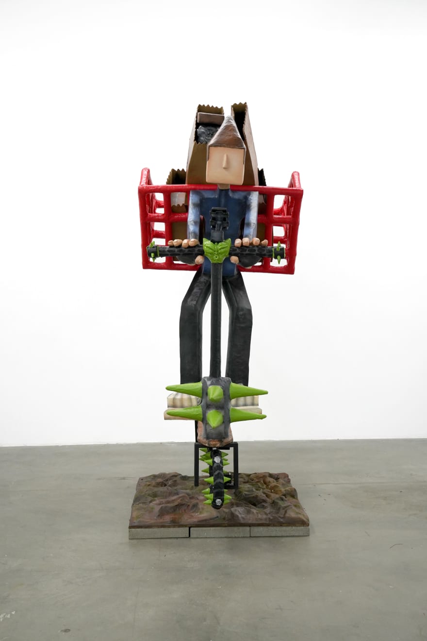 sculpture of a man on a scooter