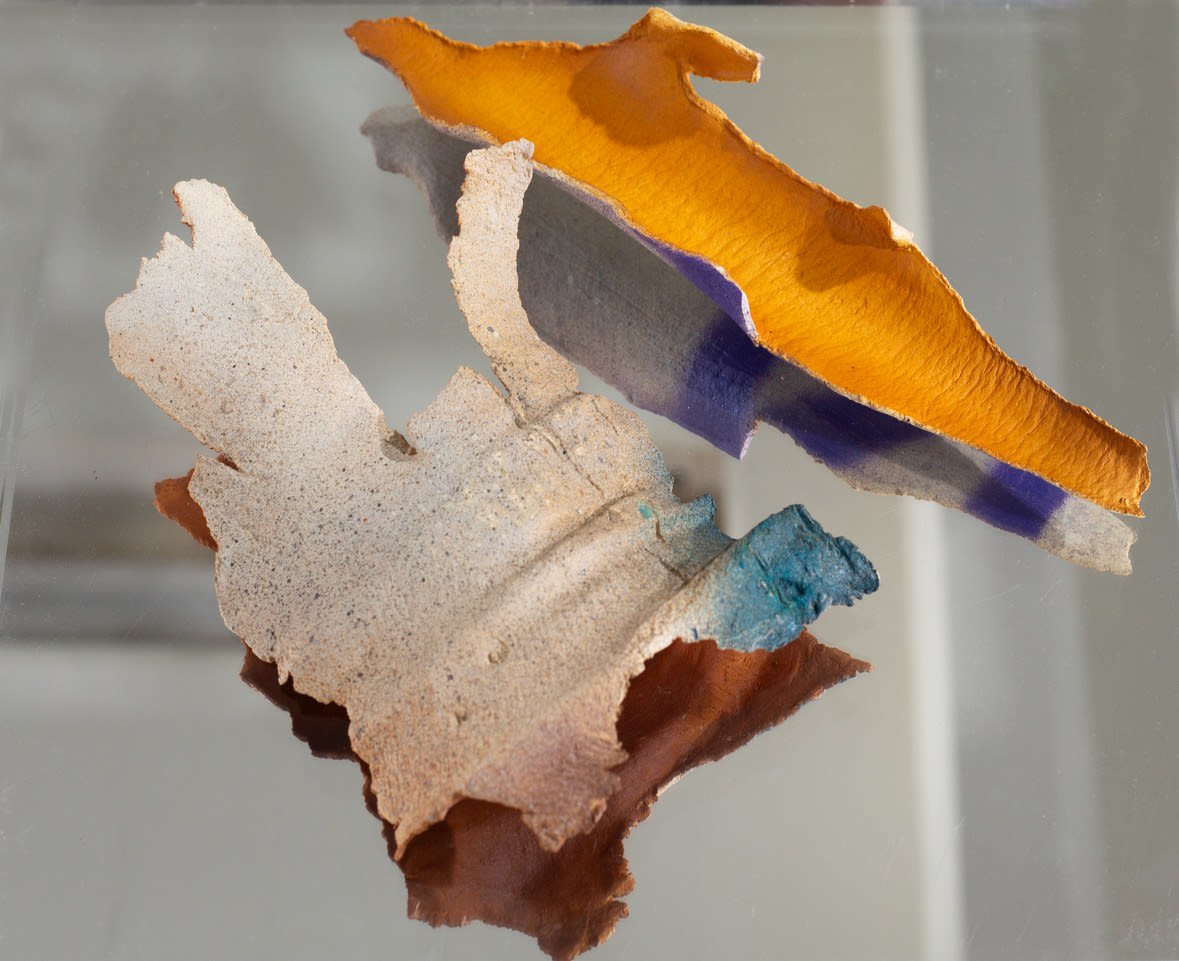 photo of a ceramic artwork made to look like pieces of bark from a eucalyptus tree