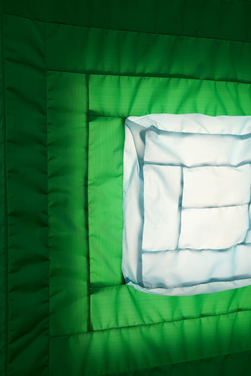 green fabric light hung on wall