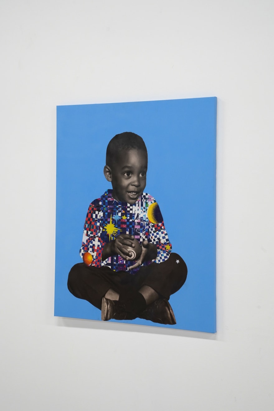 paper collage of a young child on a blue background