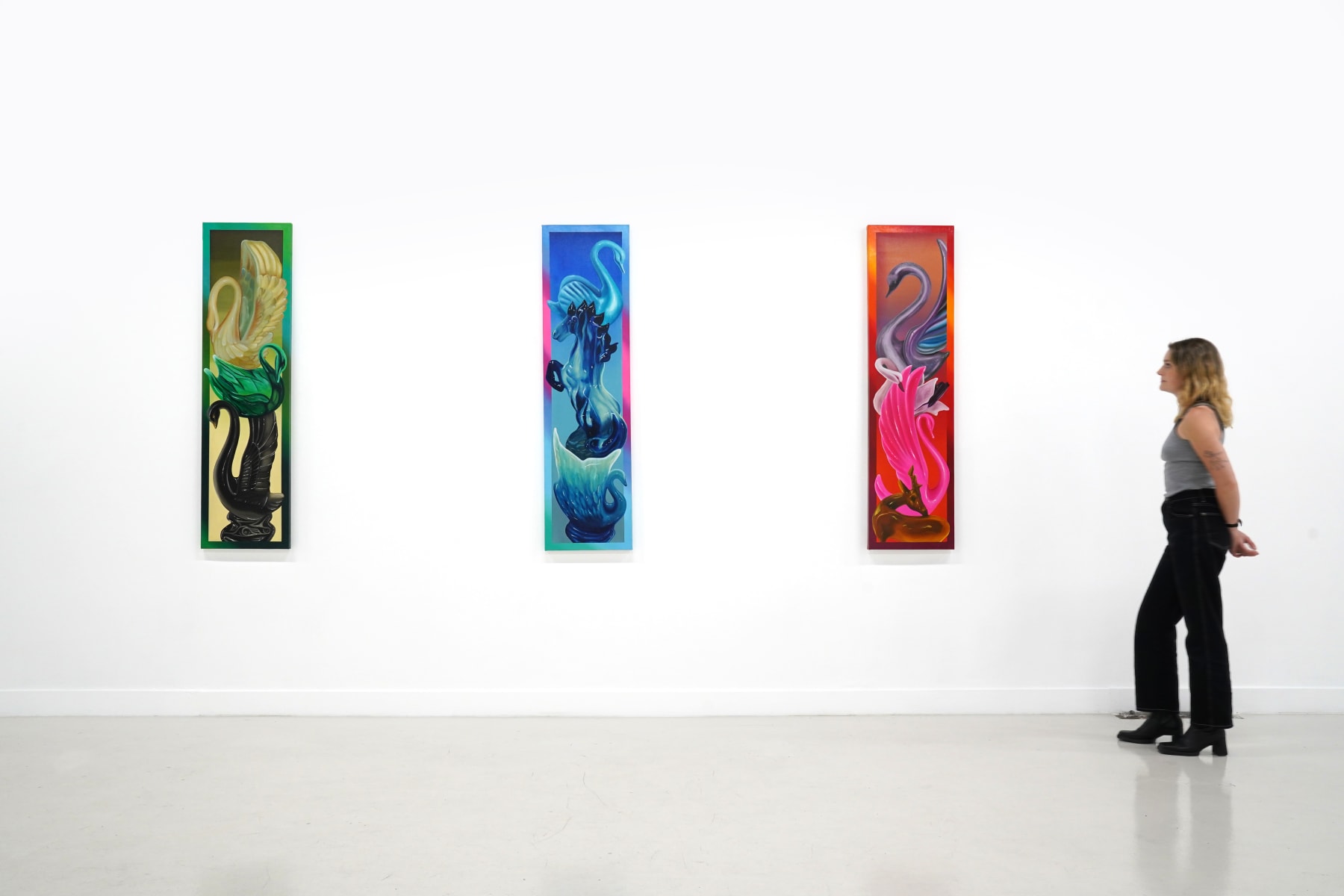 painting of a blue totem pole of swans