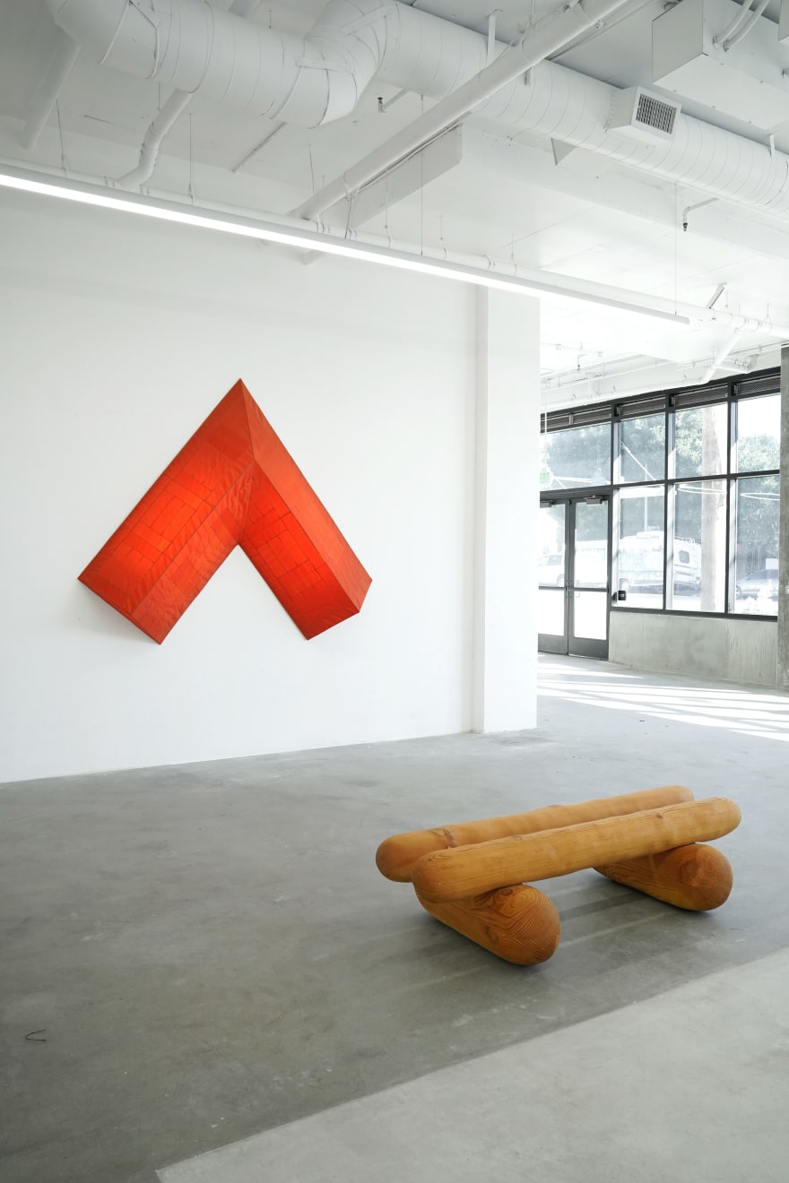 red arrow wall lamp mounted on a white wall
