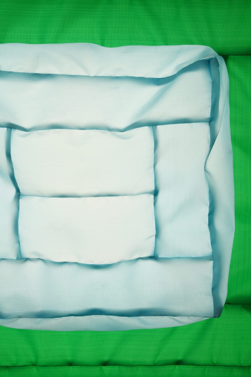 green fabric light hung on wall