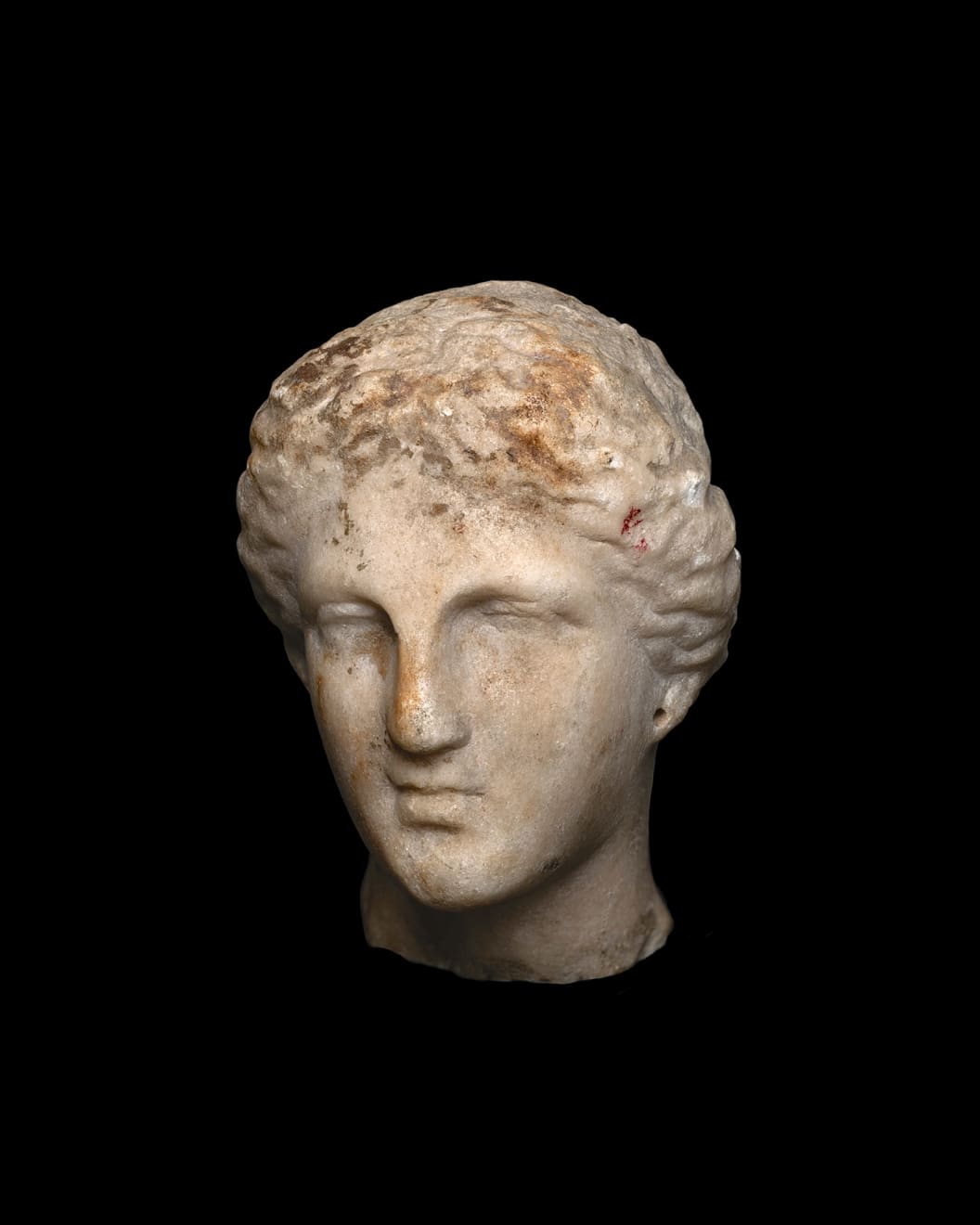 Greek, A Greek marble female head, Hellenistic, circa 4th - 3rd century BC