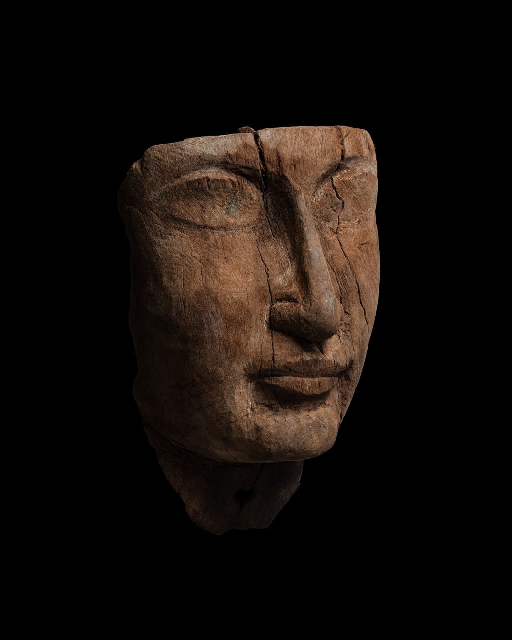 Egyptian, An Egyptian wood mummy mask, Late New Kingdom, 19th - 20th Dynasty, circa 1295 - 1070 BC