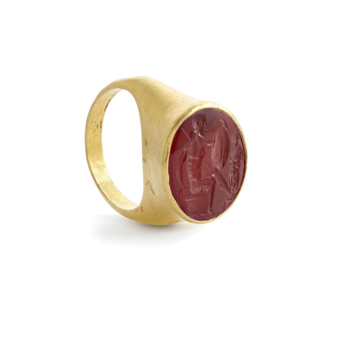 Roman A Roman carnelian intaglio of a warrior and trophy set in a gold ring circa 1st century AD intaglio Kallos Gallery