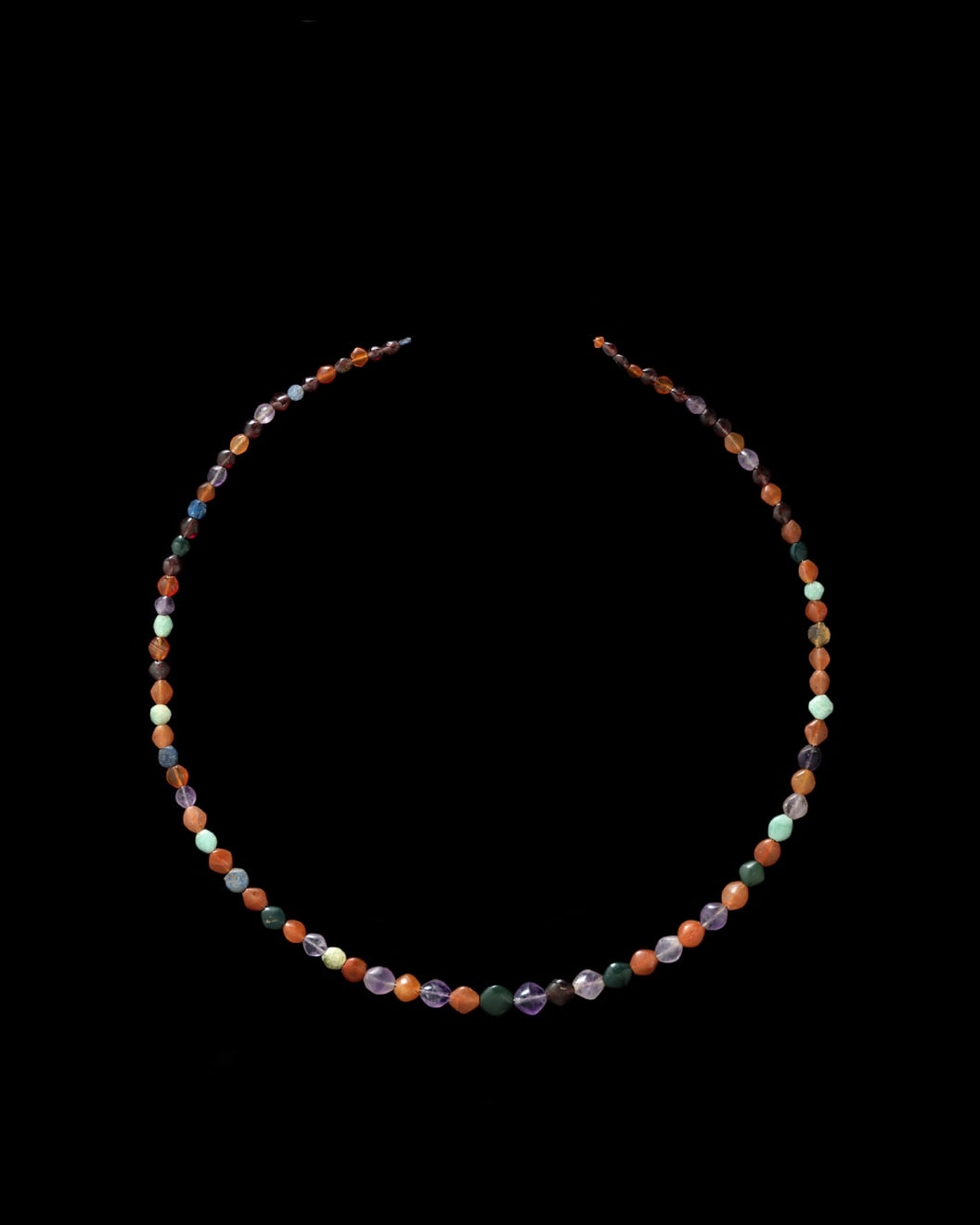 Egyptian, A necklace of Egyptian hardstone small lentoid beads, Middle Kingdom, 11th – 12th Dynasty, circa 2000 - 1800 BC