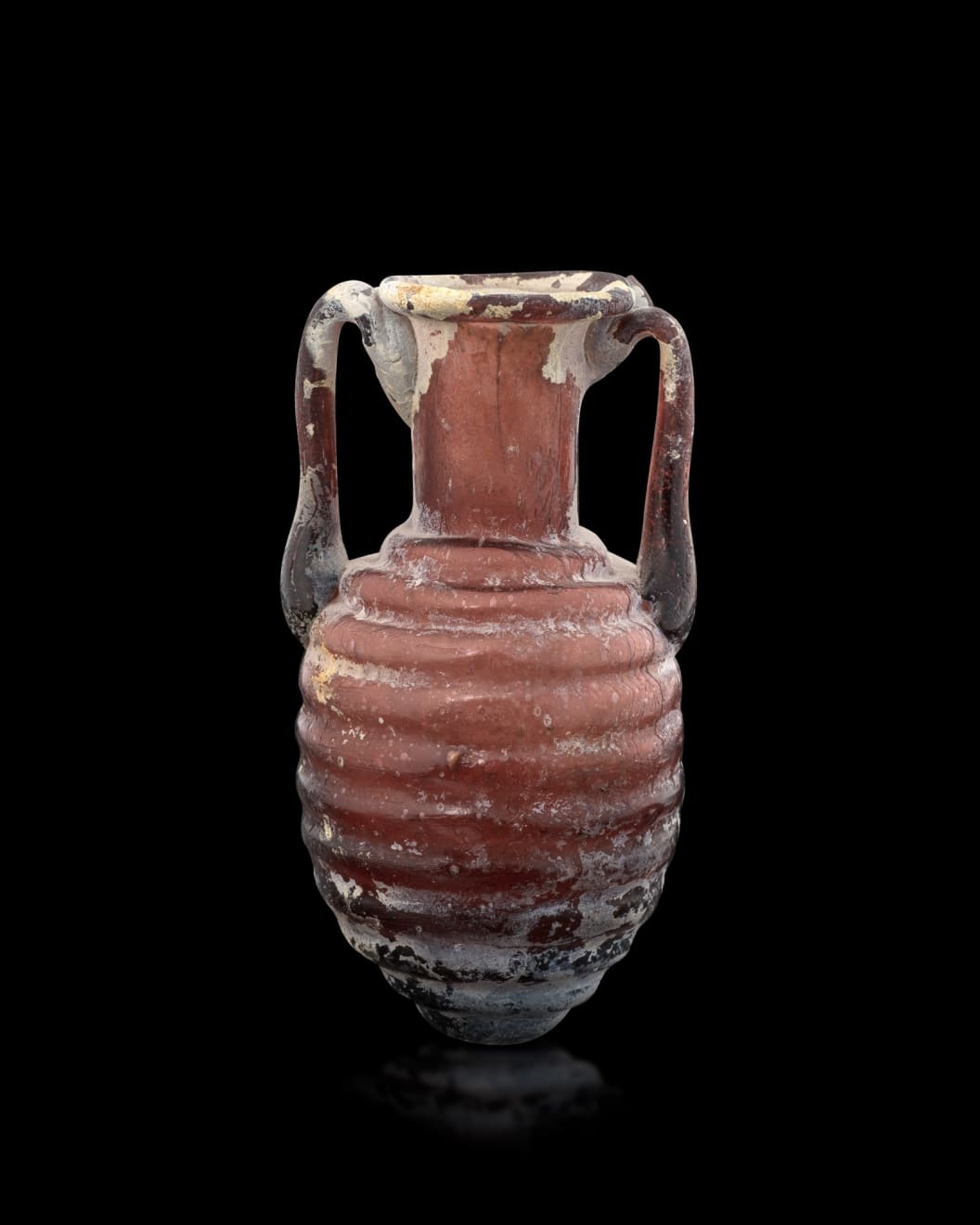 Roman, A Roman aubergine glass amphoriskos, Circa 1st - 2nd century AD