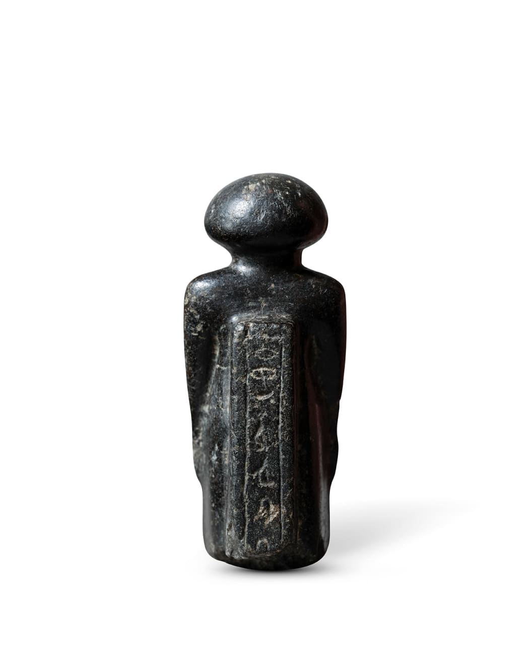 Egyptian, An Egyptian black stone figure of an official, Kumes, Middle Kingdom to Second Intermediate Period, circa 2055 - 1550 BC