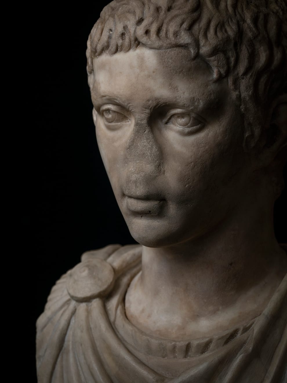Roman, A Roman marble fragmentary portrait head, probably of Elagabalus