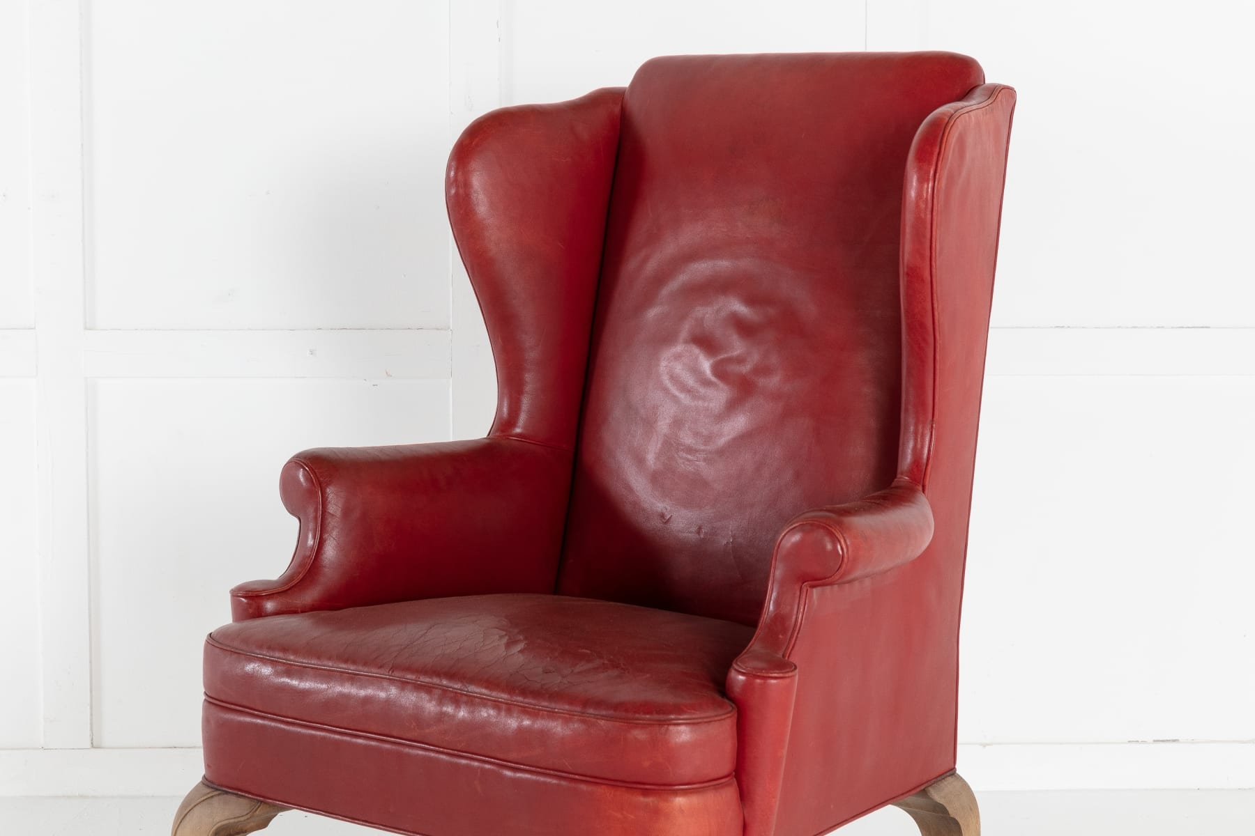 SOLD, Pair of 1950s Red Leather Wing Chairs