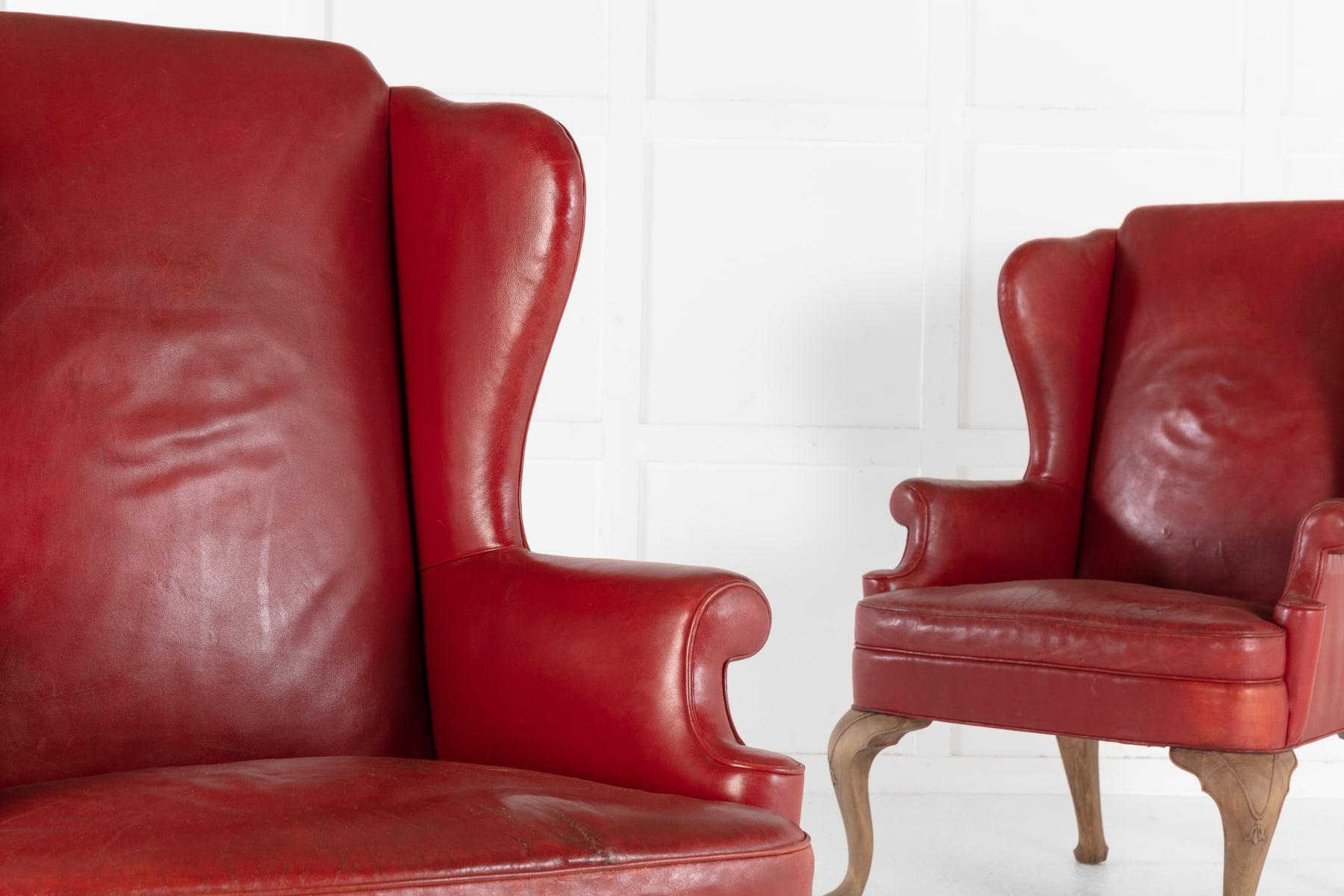 SOLD, Pair of 1950s Red Leather Wing Chairs