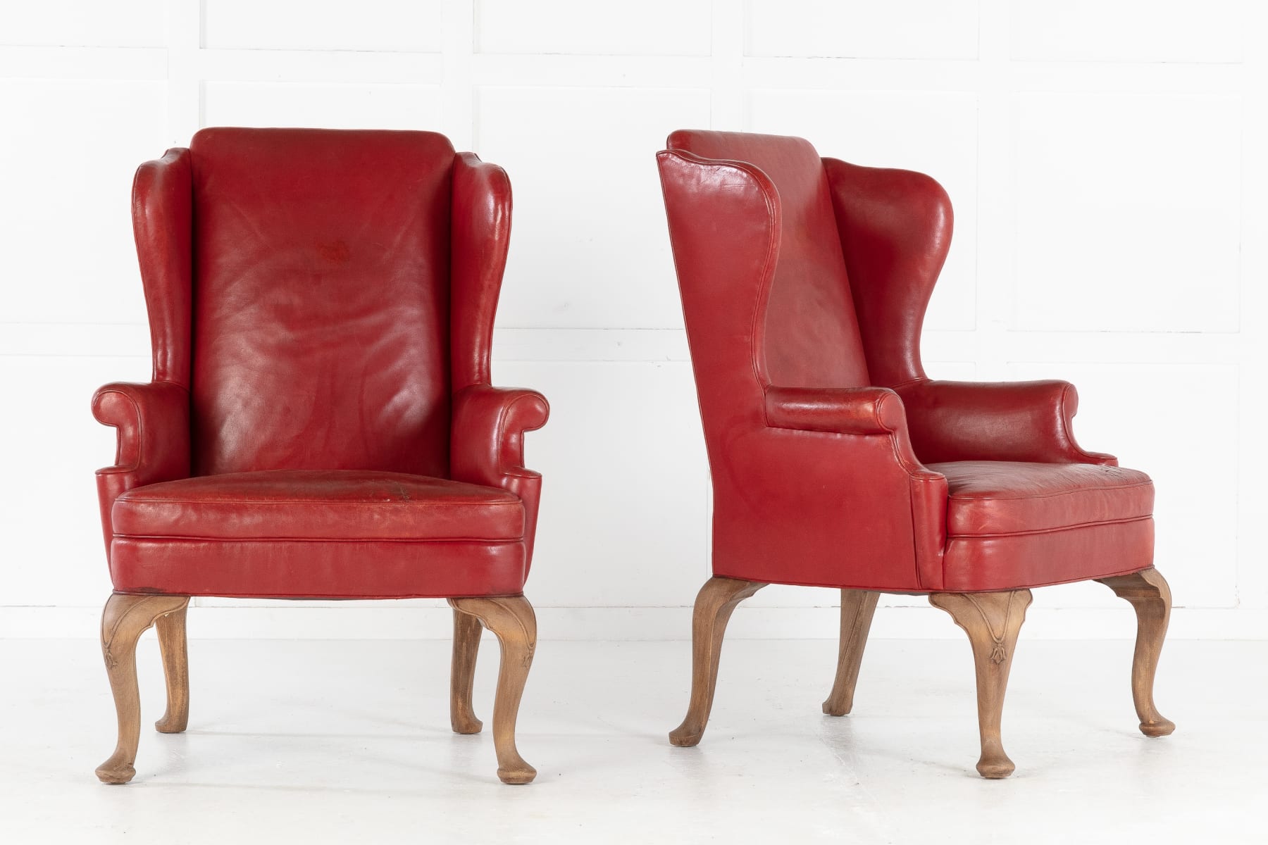 SOLD, Pair of 1950s Red Leather Wing Chairs