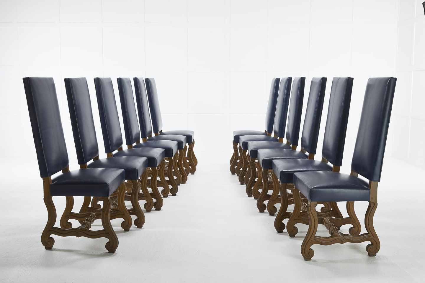 Set of Twelve 1940s French Walnut and Blue Leather Chairs