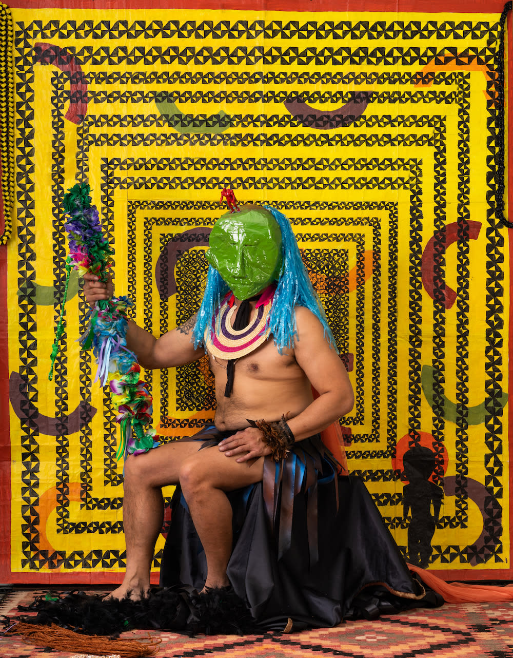 Telly Tuita, Diaspora’s Children: Seated Green Figure 2 with ‘Akau Tau (Warclub), 2022