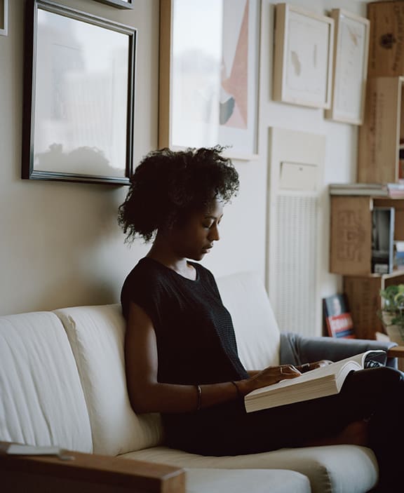 Carrie Schneider, Naomi reading Adrian Piper (Out of Order, Out of Sight, Vol. I: The Selected Readings of Meta-Art 1968-1992, pub. 1999) from Reading Women, 2014