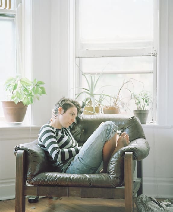 Carrie Schneider, Dana reading Virginia Woolf (To the Lighthouse, 1927)from the series Reading Women (2012-2014), 2014