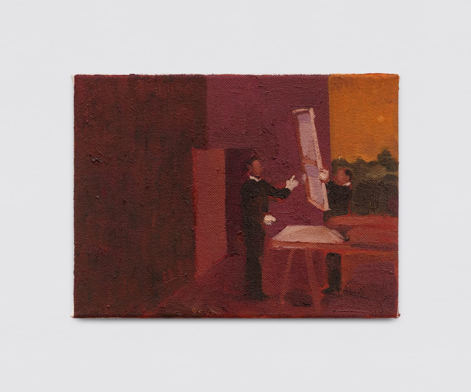 Installation view of “sambinha” (2024), a small-format figurative oil painting by Brazilian artist Thales Pomb, showing two figures handling a canvas, displayed on a white gallery wall.