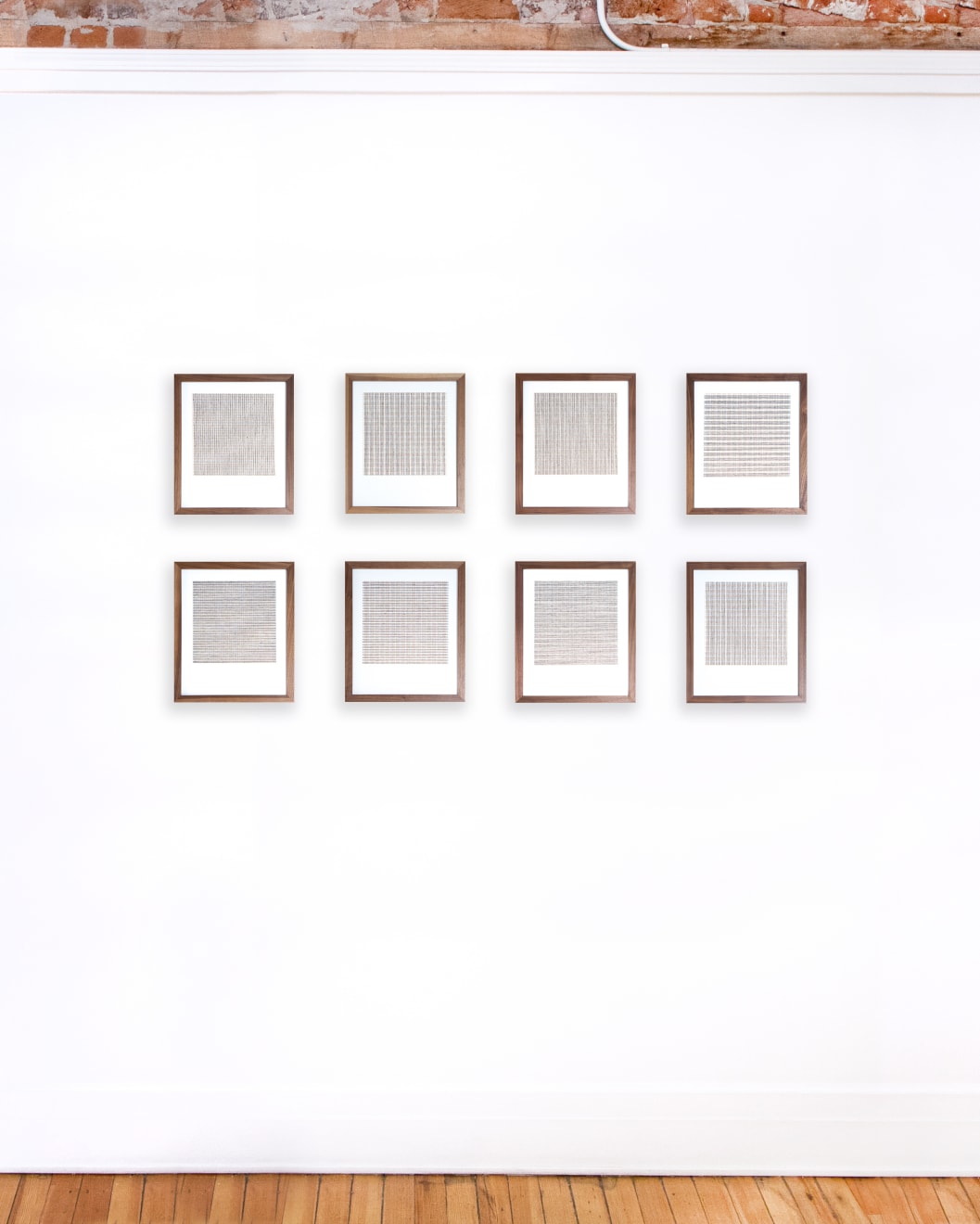 Series of framed tan thread on paper works by Fringe Gallery artist Rebecca Messier