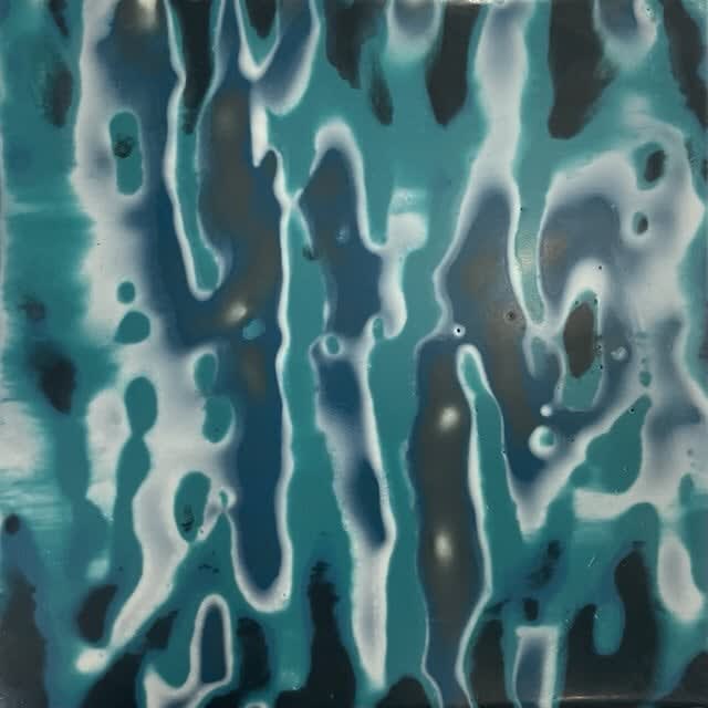 Blue Encaustic painting resembling tie-dye by slate gray gallery artist Shawna Moore