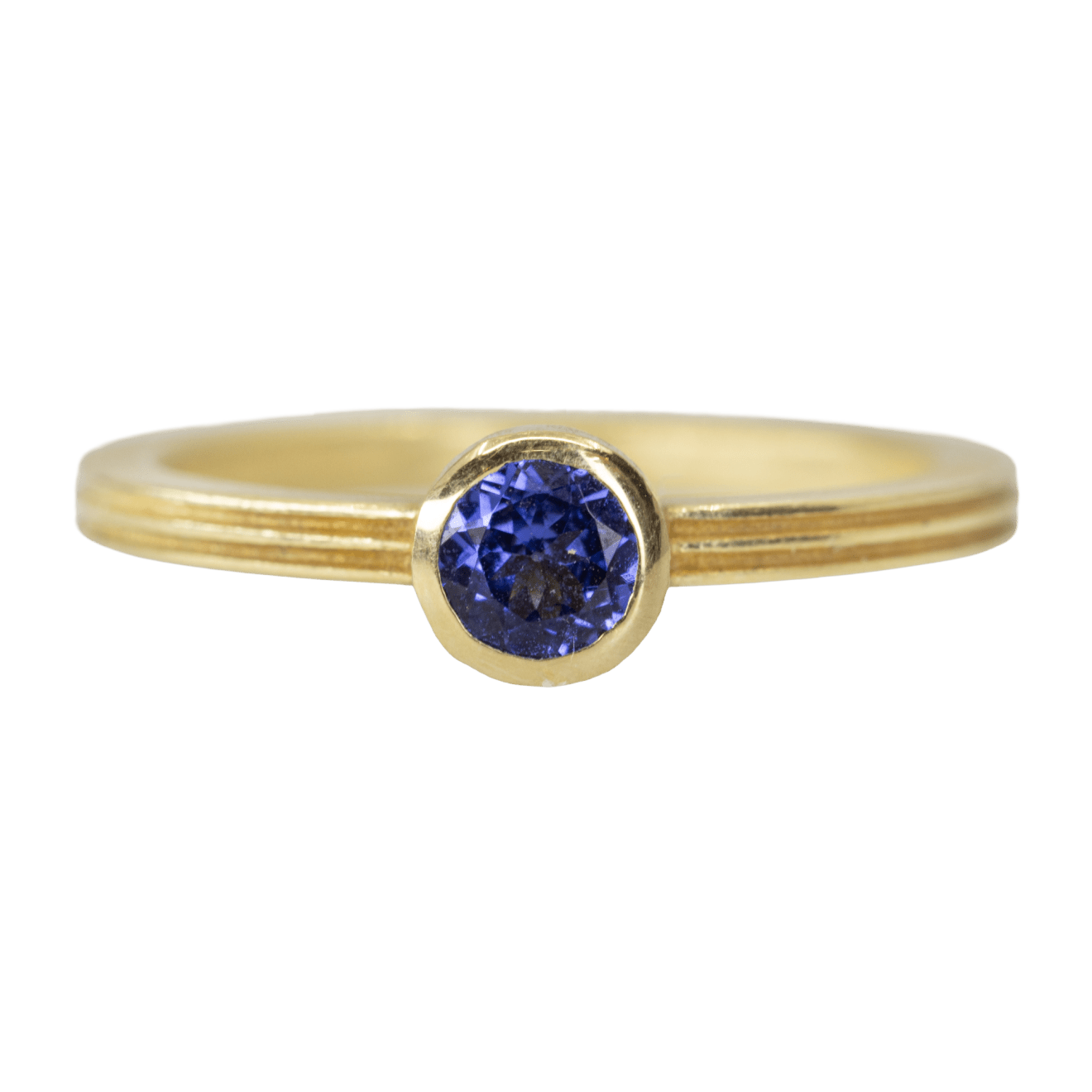 Round tanzanite ring with a fluted band by Fringe Gallery studio jeweler Barbara Heinrich