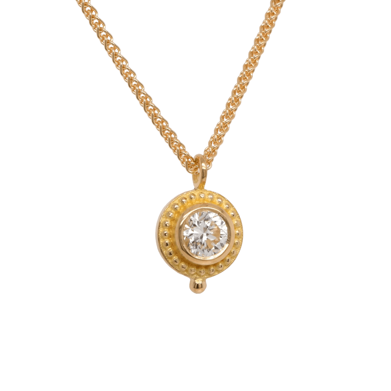 Round diamond pendant, 0.29 cttw, set in 18k gold granulated bezel on a 17