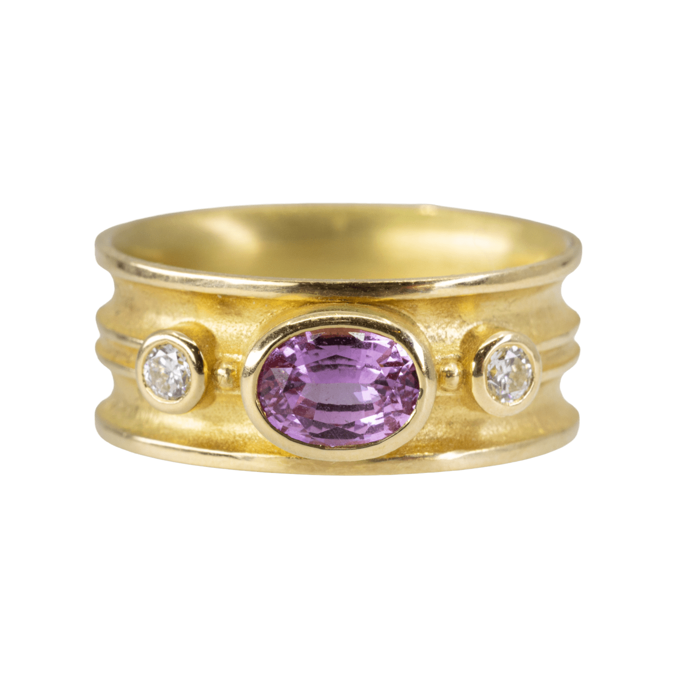 Pink oval sapphire with gold double band and two round diamonds on the side by Fringe Gallery studio jeweler Barbara Heinrich