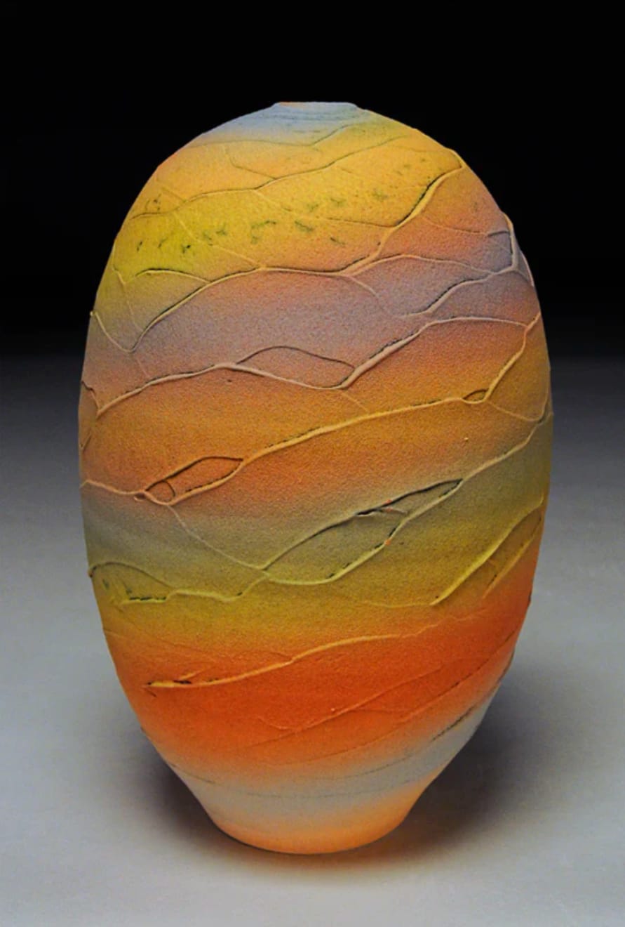 tall earthenware vessel with sunset bands of color by potter Nicholas Bernard