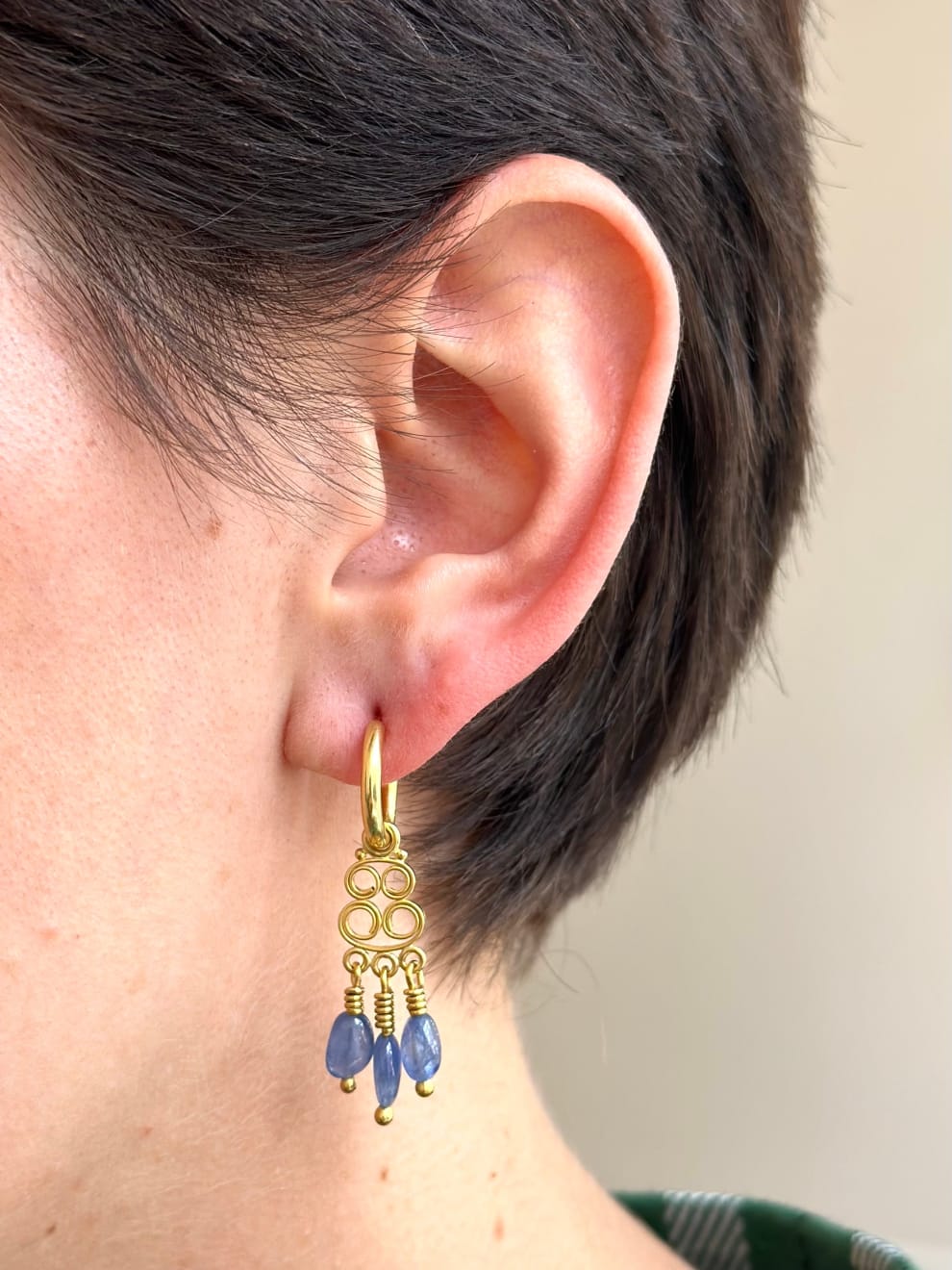22k and 20k yellow gold scroll earrings with blue sapphire drops by Fringe Gallery studio jeweler Nanci Modica