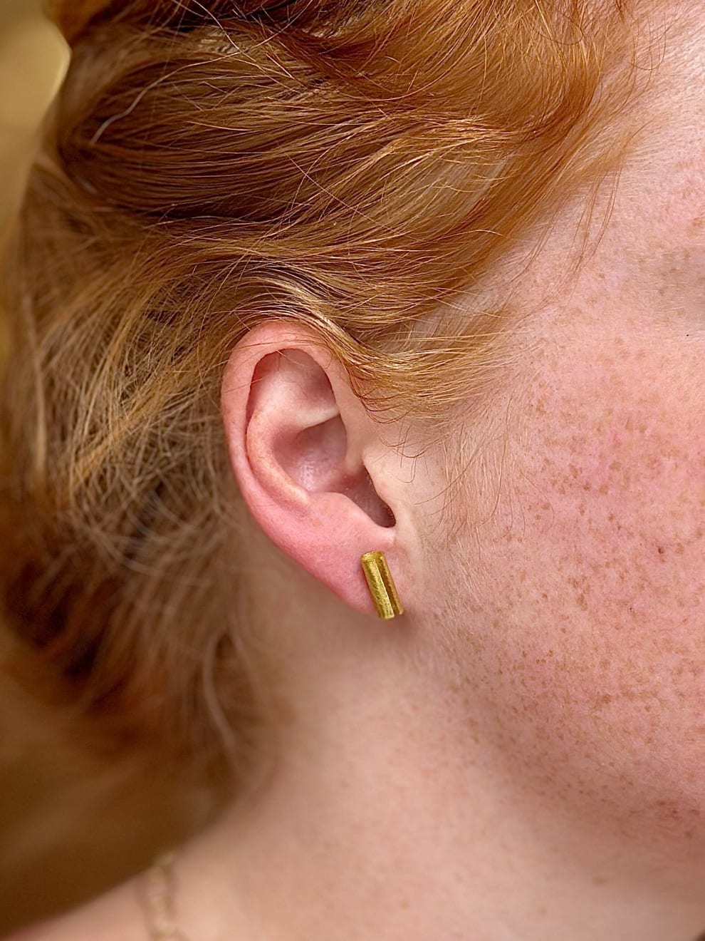 22k and 18k yellow gold tube studs by Fringe Gallery studio jeweler Petra Class