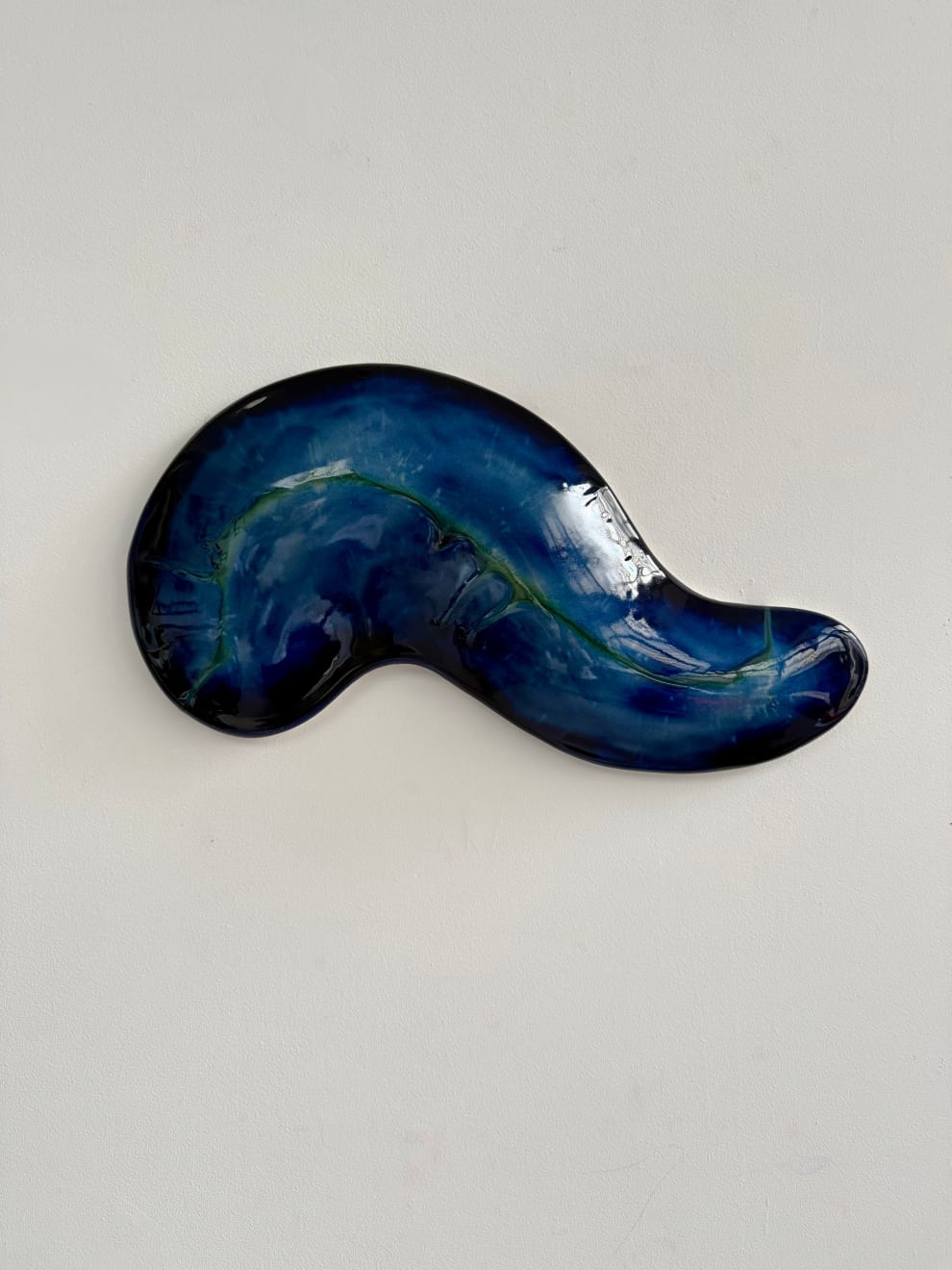 Glazed ceramic blue sculpture by Fringe Gallery artist Angela Okajima-Kempinas