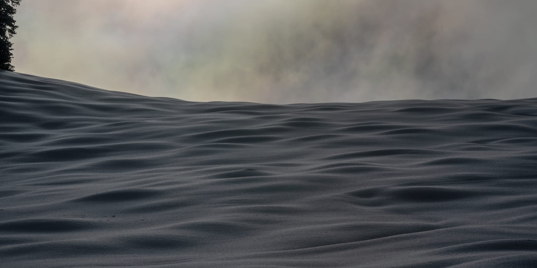 Black and white photo of snow on the telluride ski resort by Slate Gray Gallery Artist Brett Schreckengost