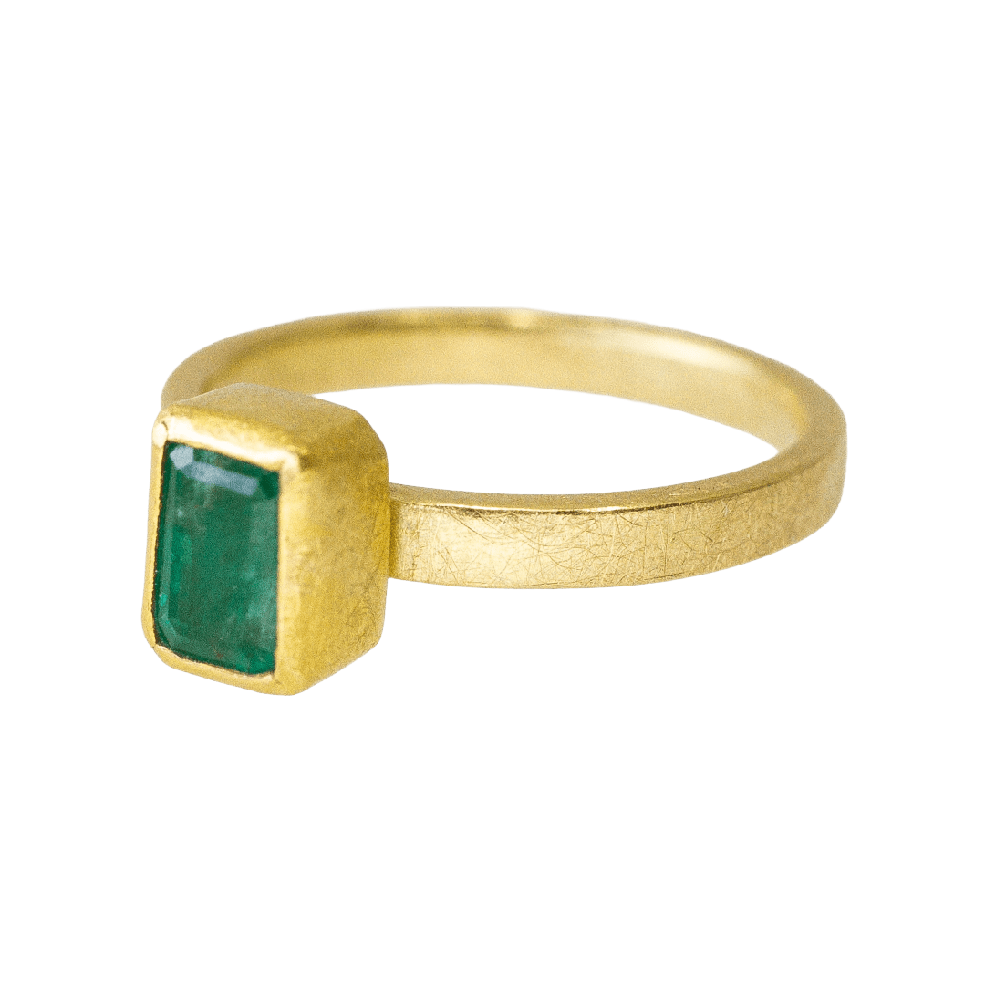 22k and 18k yellow gold ring with bezel set rectangular faceted emerald by Fringe Gallery studio jeweler Petra Class