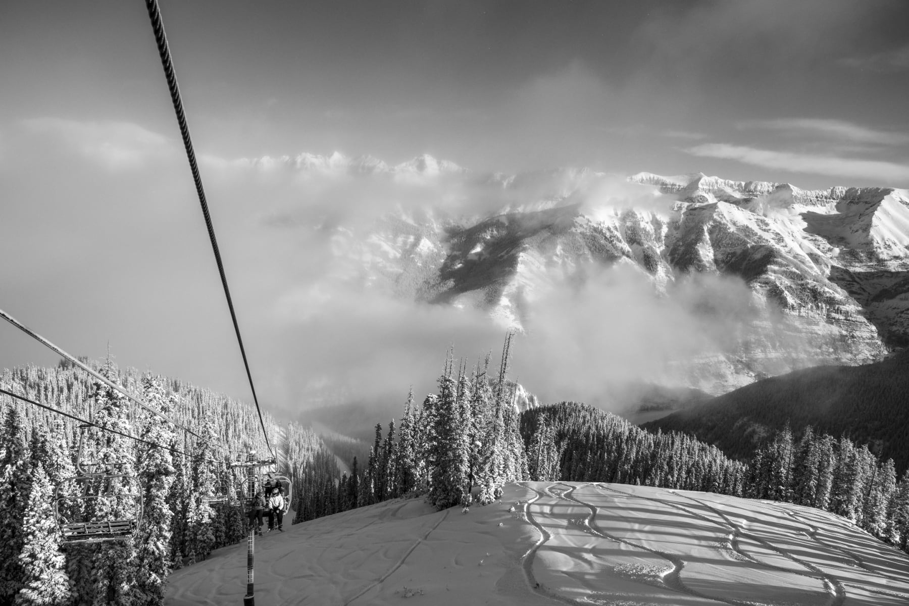 Black and white photo of a view from a ski lift by Slate Gray Gallery photographer Brett Schrekengost