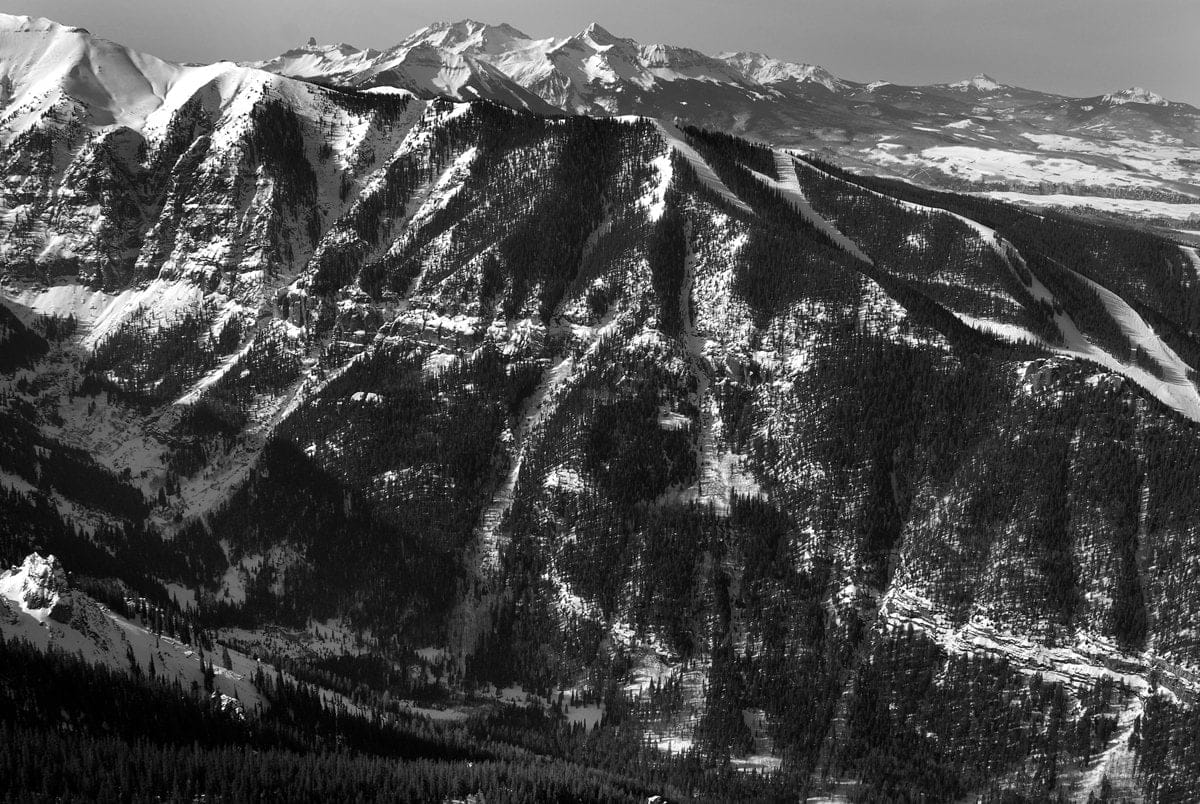 Black and white aerial photo of Lower bear creek with snow in telluride colorado taken by slate gray gallery photographer Brett Schreckengost