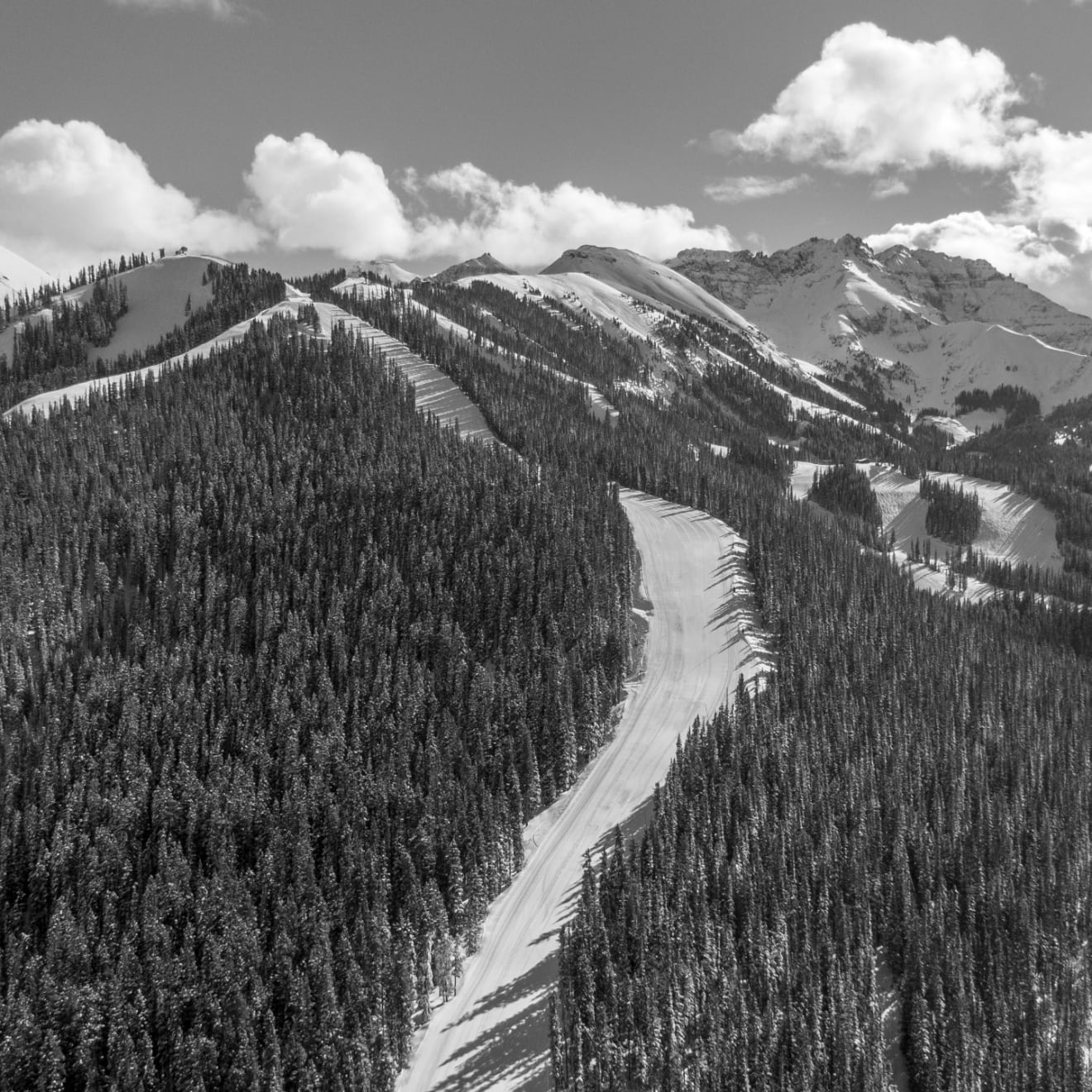 Black and white photo of an aerial shot of the See Forever Ski run on the Telluride Ski Resort by Slate Gray Gallery photographer Brett Schrekengost