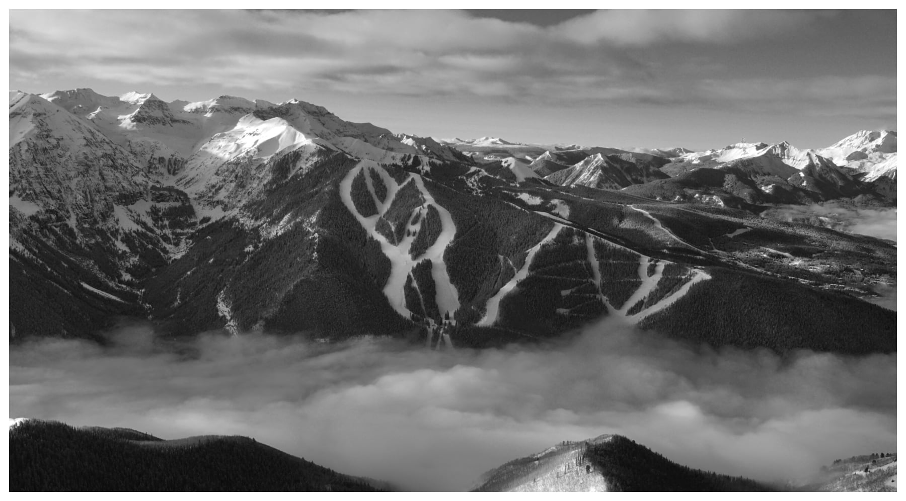 Black and White aerial photo of ski chutes on the telluride ski resort by slate gray gallery artist Brett Schreckengost