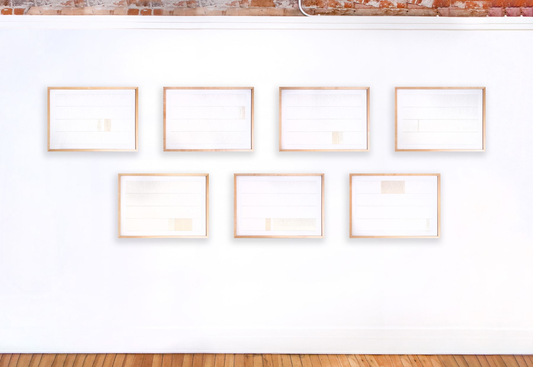 Framed white and tan thread on paper works by Fringe Gallery artist Rebecca Messier